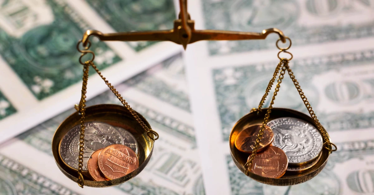 balança com moedas representando a pré-executividade